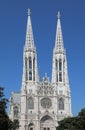 Two white bell towers of the VOTIVE CHURCH in Wien in Austria In Central Europe Royalty Free Stock Photo