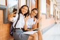 two high school students waving hands during a video call Royalty Free Stock Photo