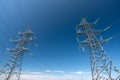 Two high-voltage power transmission poles Royalty Free Stock Photo