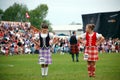 Two Highland Dancers Chatting