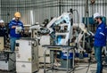 Two highly competent robotic operators collaborate to configure new automation