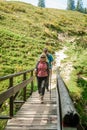 Two hiker on a wooden bridge Royalty Free Stock Photo