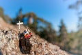 Two hikers with backpack relaxing on top of a mountain