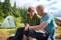 Two hikers discussing the route, looking at the map Royalty Free Stock Photo