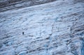 Two hikers on a glacier hike in the middle of the Exit Glacier in Kenai Fjords National Park