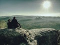 Two hikers on hill top looks at mountains Royalty Free Stock Photo