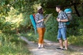 Two Hikers looking Map staying on Forest Trail Royalty Free Stock Photo