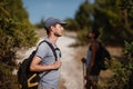 Two hikers men walk on trek in mountain. Trekking in mountains. Hills and mounts in sport tourism Royalty Free Stock Photo