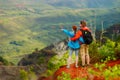 Two hikers relaxing enjoying the amazing view