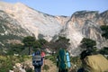 Two hikers on trail in mountains