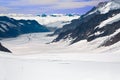 Two Hikers Walking Towards the Aletsch Glacier