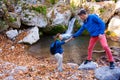 Two Hikers young Man and Smiling Woman holding hands Royalty Free Stock Photo