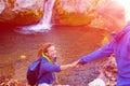 Two Hikers young Man and Smiling Woman holding hands Sunny Royalty Free Stock Photo