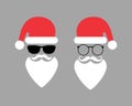 Two hipster Santa Clauses with beard, sunglasses, hat, mustache and glasses.