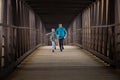 Two Hispanic Brothers Run A Race Down Bridge