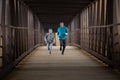 Two Hispanic Brothers Run A Race Down Bridge