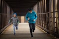 Two Hispanic Brothers Run A Race Down Bridge