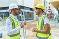 Two hispanic men architects doing ok gesture speaking at street Royalty Free Stock Photo