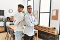 Two hispanic men business workers standing with arms crossed gesture at office Royalty Free Stock Photo