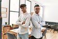 Two hispanic men business workers standing with arms crossed gesture at office Royalty Free Stock Photo