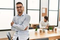 Two hispanic men business workers standing with arms crossed gesture at office Royalty Free Stock Photo