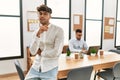 Two hispanic men business workers standing with arms crossed gesture at office Royalty Free Stock Photo