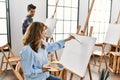 Two hispanic students painting at art school Royalty Free Stock Photo