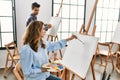 Two hispanic students painting at art school Royalty Free Stock Photo