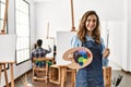 Two hispanic students painting at art school Royalty Free Stock Photo