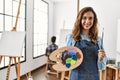 Two hispanic students painting at art school Royalty Free Stock Photo