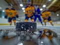 Two hockey players engage in a fierce match on the icy rink, chasing after the puck with precision and skill Royalty Free Stock Photo