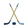 Two hockey sticks of different colors and a puck. Ice hockey and field hockey sticks. Sports equipment for game sports Royalty Free Stock Photo