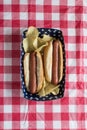 Two hog dogs with chips on Fourth of July setting vertical