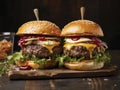 Two homemade beef burgers with mushrooms, micro greens, red onion, fried eggs and beet sauce on wooden cutting board. Side view,