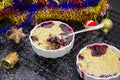Two Homemade delicious crumble with berries in portioned ramekin