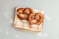 Two traditional soft Octoberfest pretzels in bread basket, copy space Royalty Free Stock Photo