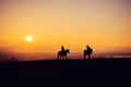 Two Horse Riders on Silhouetted on Sunset Field, Beautiful Peaceful Sport Landscape