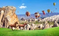 Two horses running and hot air balloons in Cappadocia, Turkey