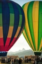 Two hot air balloons at a balloon rally. Royalty Free Stock Photo