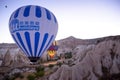 two hot air balloons full of tourists, taking off at dawn between fairy chimneys, cappadocia Turkey Royalty Free Stock Photo