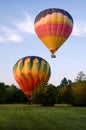 Two hot-air balloons taking off or landing