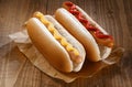 Two hotdogs with mustard and ketchup Royalty Free Stock Photo