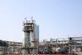 Two huge high metal tanks, barrels, heat exchanging equipment, pumps, pipes, pipeline estocades with valves at an oil refinery, pe
