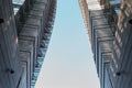 Milan, Italy, March 2020. Two huge multi-story buildings, skyscrapers opposite each other. Against the background of blue sky. Royalty Free Stock Photo