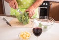 Two human hands of a senior man cut and clean the broccoli vegetable. Healthy eating Royalty Free Stock Photo