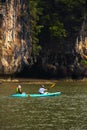 Two human on one canoe