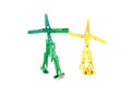 Two human shaped clothespins isolated on a white background Royalty Free Stock Photo