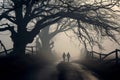 Two human silhouettes walking on empty road during fog Royalty Free Stock Photo