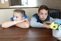 Two hungry boys waiting food Royalty Free Stock Photo