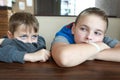 Two hungry children waiting food